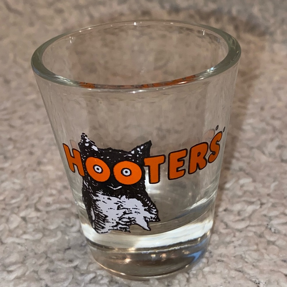 Hooters shot glass, white orange with owl logo, no city specified